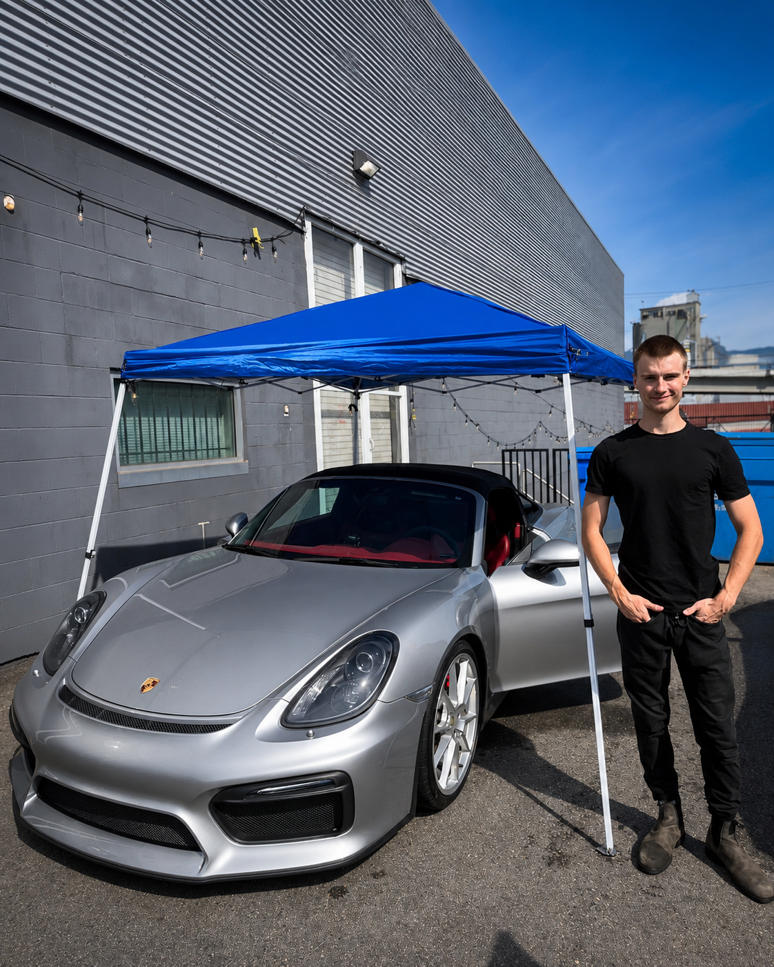 Charles of Liggett Mobile Detailing beside a freshly detailed silver Porsche Boxster Spyder in Vancouver BC
